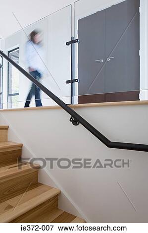 Person walking in house View Large Photo Image Stock Photo - Person walking in house. Fotosearch