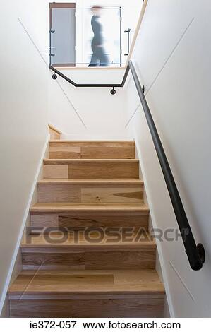 Person walking in house View Large Photo Image Stock Photo - Person walking in house. Fotosearch