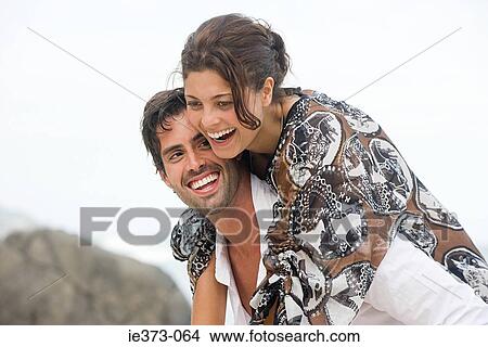 Hispanic couple having a piggyback View Large Photo Image Picture - Hispanic couple having a piggyback. Fotosearch