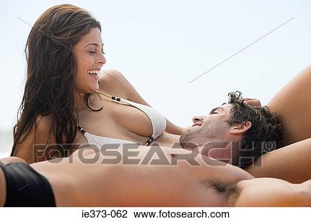 Hispanic couple relaxing in swimwear View Large Photo Image Stock Image - Hispanic couple relaxing in swimwear. Fotosearch