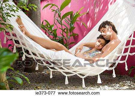 Hispanic couple sleeping in a hammock View Large Photo Image Stock Photo - Hispanic couple sleeping in a hammock. Fotosearch