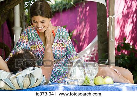 Stock Image - Intimate couple in the shade. Fotosearch