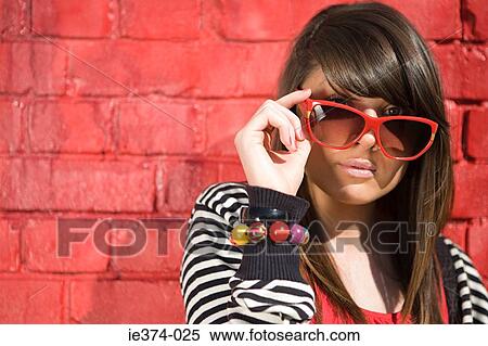 Stock Photography - Girl wearing sunglasses. Fotosearch