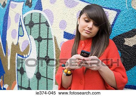 Girl with cellphone View Large Photo Image Stock Photography - Girl with cellphone. Fotosearch