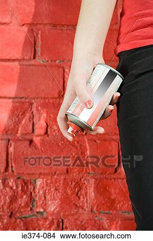Girl with spray paint View Large Photo Image Picture - Girl with spray paint. Fotosearch