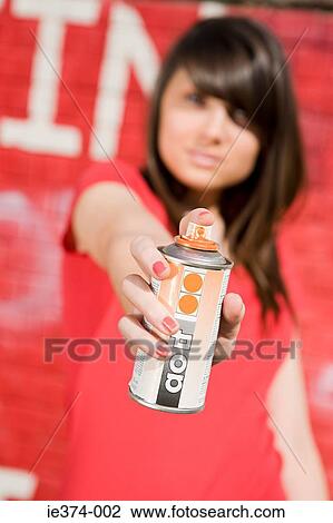 Girl with spray paint View Large Photo Image Stock Image - Girl with spray paint. Fotosearch