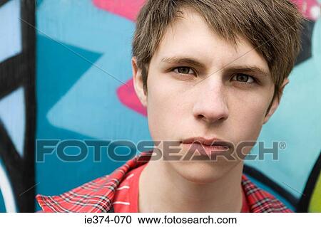 Stock Image - Serious teenage boy. Fotosearch