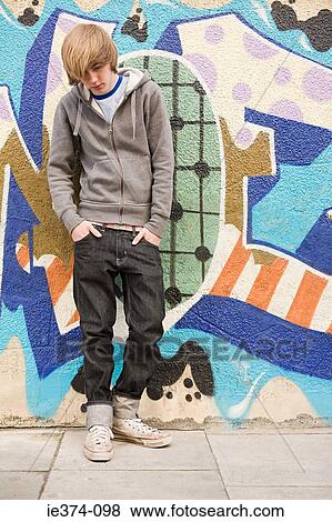 Stock Photo - Teenage boy looking down. Fotosearch