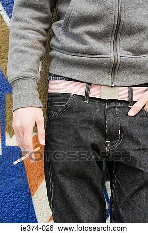 Stock Photograph - Teenage boy smoking. Fotosearch