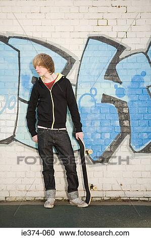 Teenage boy with skateboard View Large Photo Image Stock Image - Teenage boy with skateboard. Fotosearch