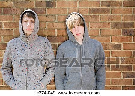 Stock Photo - Teenage boys in hoodies. Fotosearch