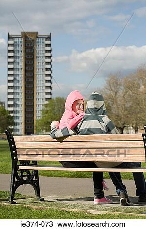 Stock Image - Teenage couple in hoodies. Fotosearch