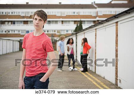 Teenagers by garages View Large Photo Image Stock Photo - Teenagers by garages. Fotosearch