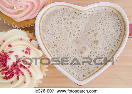 Coffee in a heart shaped cup View Large Photo Image Stock Photo - Coffee in a heart shaped cup. Fotosearch
