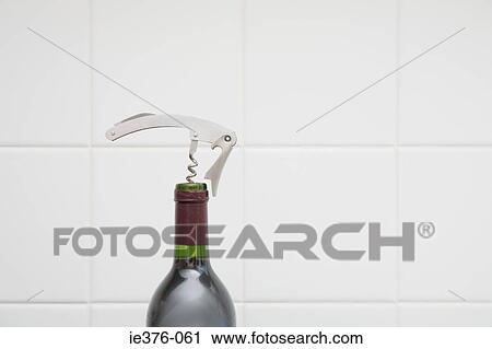 Stock Image - Corkscrew in wine. Fotosearch