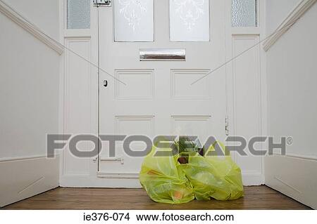 Shopping bags by front door View Large Photo Image Picture - Shopping bags by front door. Fotosearch