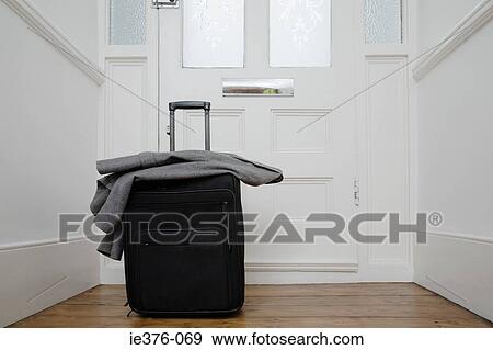 Suitcase by front door View Large Photo Image Stock Photo - Suitcase by front door. Fotosearch