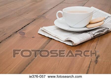 Tea and newspaper on floor View Large Photo Image Stock Photo - Tea and newspaper on floor. Fotosearch