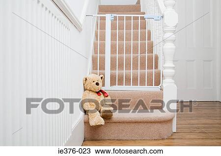Teddy bear and stair gate View Large Photo Image Stock Image - Teddy bear and stair gate. Fotosearch