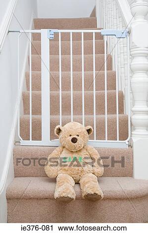Teddy bear and stair gate View Large Photo Image Stock Image - Teddy bear and stair gate. Fotosearch