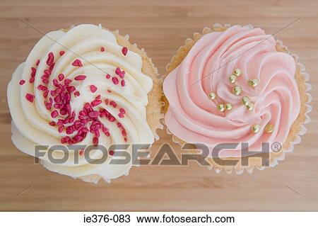 Two cupcakes View Large Photo Image Stock Image - Two cupcakes. Fotosearch