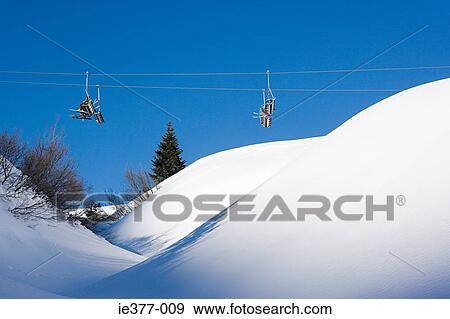 People on a ski lift View Large Photo Image Stock Photo - People on a ski lift. Fotosearch