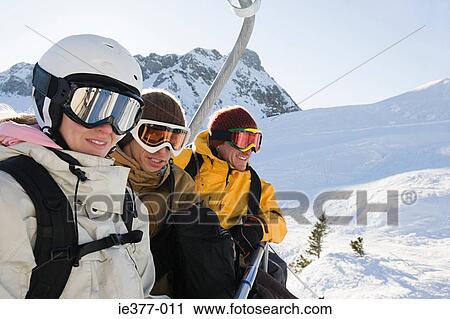 People sat on a ski lift View Large Photo Image Stock Image - People sat on a ski lift. Fotosearch