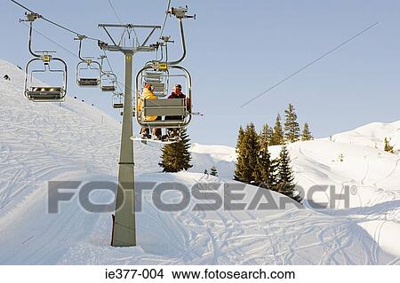 Two men on a ski lift View Large Photo Image Picture - Two men on a ski lift. Fotosearch