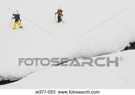 Two men skiing View Large Photo Image Stock Image - Two men skiing. Fotosearch