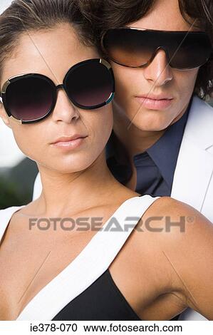 Stylish hispanic couple wearing sunglasses View Large Photo Image Stock Image - Stylish hispanic couple wearing sunglasses. Fotosearch