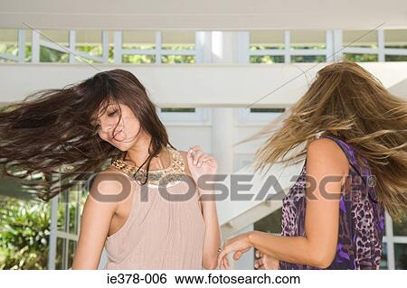 Two women dancing at home View Large Photo Image Stock Photograph - Two women dancing at home. Fotosearch