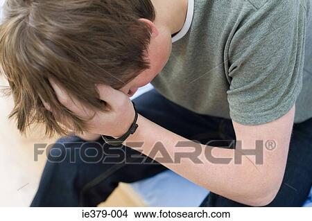 A teenage boy crying View Large Photo Image Picture - A teenage boy crying. Fotosearch