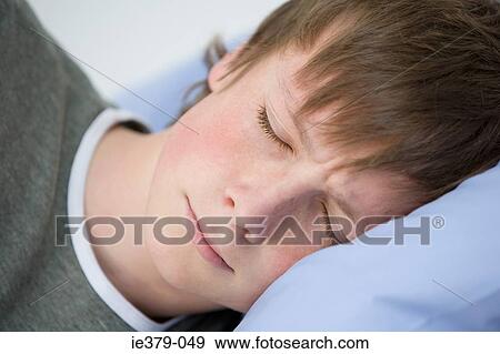 A teenage boy sleeping View Large Photo Image Stock Photo - A teenage boy sleeping. Fotosearch