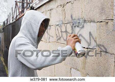 A teenage boy using a spray can View Large Photo Image Stock Image - A teenage boy using a spray can. Fotosearch
