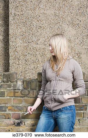 A teenage girl smoking View Large Photo Image Stock Image - A teenage girl smoking. Fotosearch