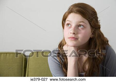 Stock Photo - A teenage girl thinking. Fotosearch