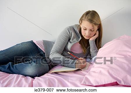 A teenage girl writing in her diary View Large Photo Image Stock Photo - A teenage girl writing in her diary. Fotosearch