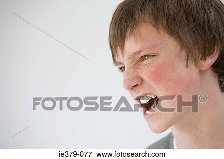 An angry teenage boy View Large Photo Image Stock Photo - An angry teenage boy. Fotosearch