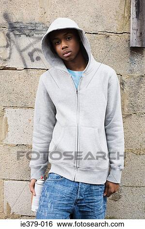 Portrait of a teenage boy holding a spray can View Large Photo Image Stock Photograph - Portrait of a teenage boy holding a spray can. Fotosearch