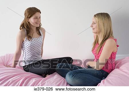 Stock Photograph - Teenage girls talking. Fotosearch