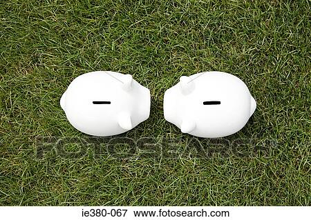 Two piggy banks face to face View Large Photo Image Stock Photo - Two piggy banks face to face. Fotosearch