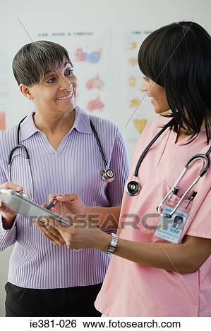A doctor and a nurse View Large Photo Image Stock Photograph - A doctor and a nurse. Fotosearch