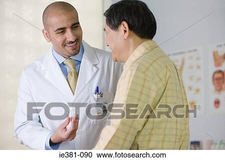 A doctor and a patient View Large Photo Image Stock Image - A doctor and a patient. Fotosearch