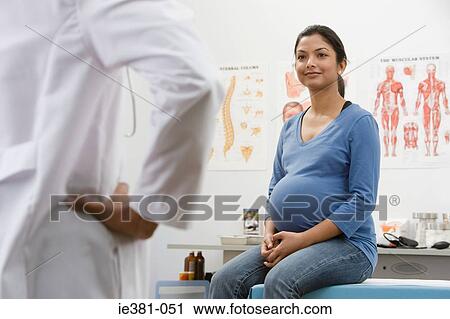 A doctor and a pregnant patient View Large Photo Image Stock Image - A doctor and a pregnant patient. Fotosearch