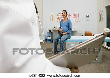 A doctor and a pregnant patient View Large Photo Image Stock Image - A doctor and a pregnant patient. Fotosearch