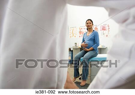 A doctor and a pregnant patient View Large Photo Image Stock Image - A doctor and a pregnant patient. Fotosearch