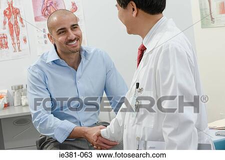 A doctor and patient shaking hands View Large Photo Image Stock Image - A doctor and patient shaking hands. Fotosearch