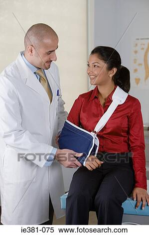 A doctor examining a patient View Large Photo Image Stock Photography - A doctor examining a patient. Fotosearch