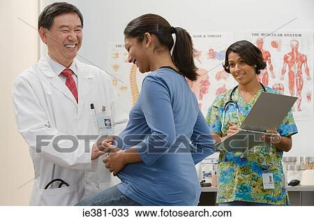 A doctor examining a pregnant woman View Large Photo Image Stock Image - A doctor examining a pregnant woman. Fotosearch