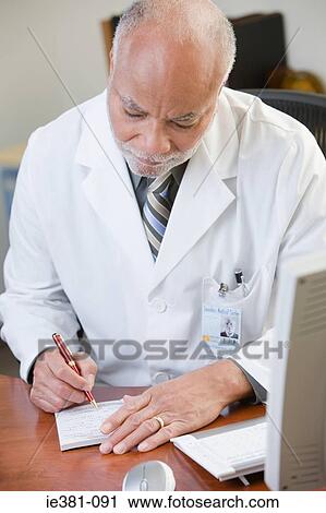 A doctor writing a prescription View Large Photo Image Stock Image - A doctor writing a prescription. Fotosearch